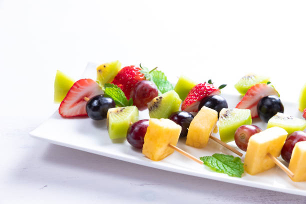 istock Ripe fruit in season on skewers 1147542880
