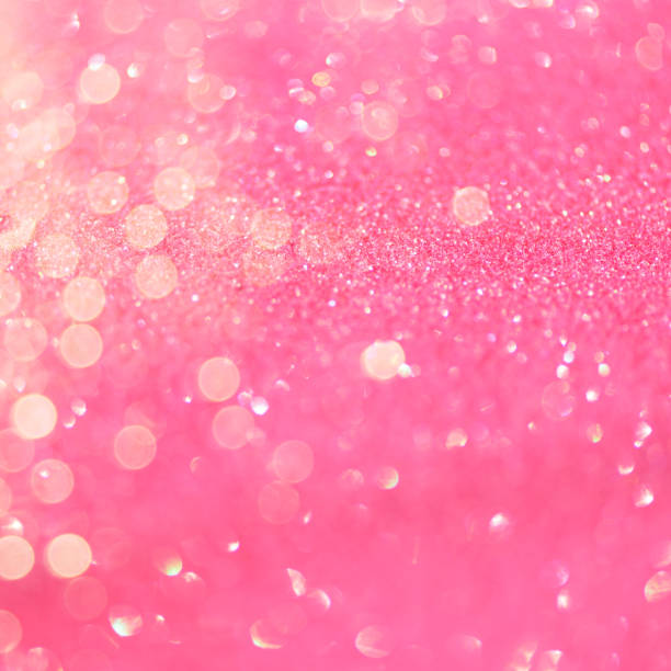 istock Festive pink background with copy space. Abstract sparkling lights, shiny holiday background. Square crop 1147544420
