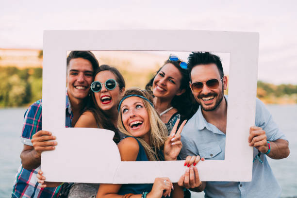 istock Group of young happy friends having fun time 1147544430