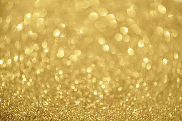 istock Sparkle glittering background. Holiday abstract texture. Christmas card with copy space, gold bokeh, defocused lights. 1147544554