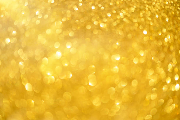 istock Holiday abstract texture. Christmas card with copy space. Gold bokeh background, defocused lights. 1147544607