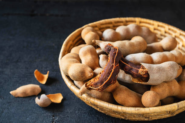 istock Tamarind in a wooden basket on the table 1147545013