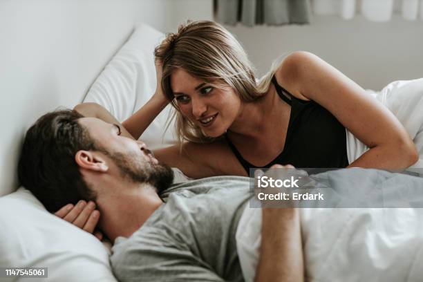 Romantic Moment Happy Couple In Love In The Bed Stock Image Stock Photo - Download Image Now