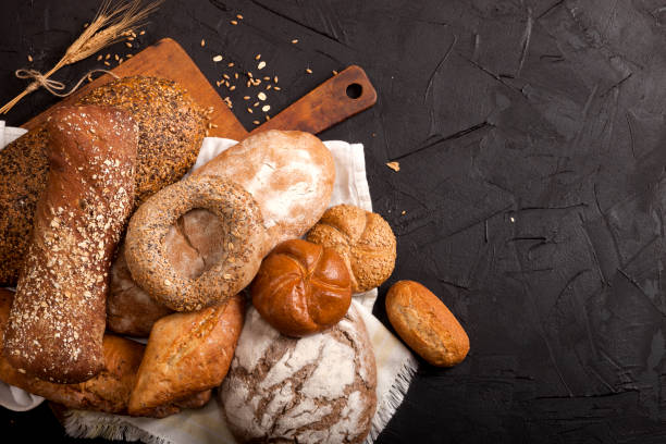 istock Assortment of baked goods on dark background 1147550785