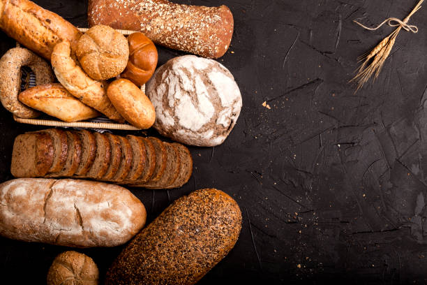 istock Assortment of baked goods on dark background 1147550845