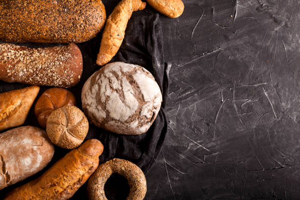 istock Assortment of baked goods on dark background 1147550937