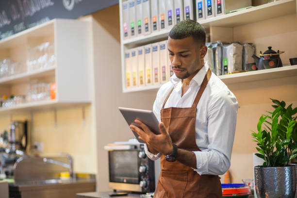 istock Young afro-american bar owner ordering stock 1147551981