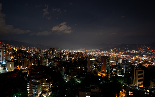 Beautiful view of the city of Medellin, Colombia at nighttime - travel destination concepts