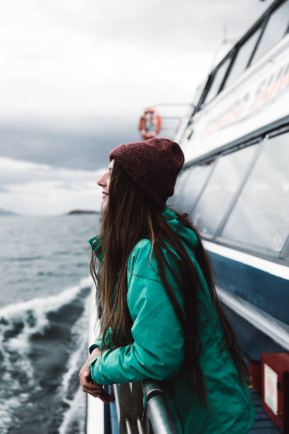 istock Woman looking at ocean from the ship in Ushuaia 1147552607