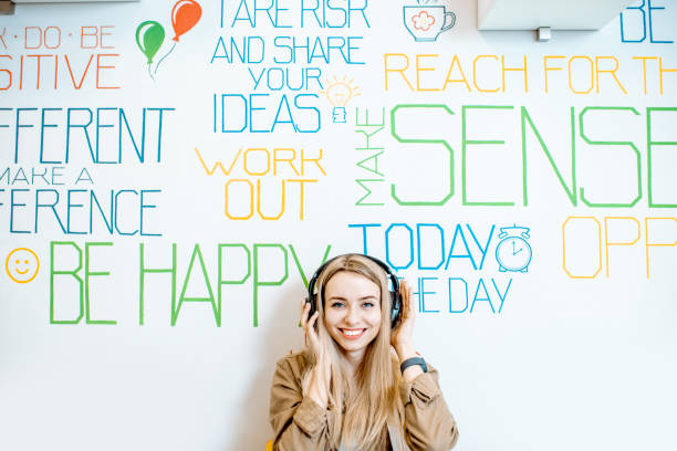 istock Woman on the wall background with various inscriptions 1147553792