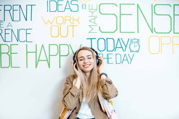 istock Woman on the wall background with various inscriptions 1147553813