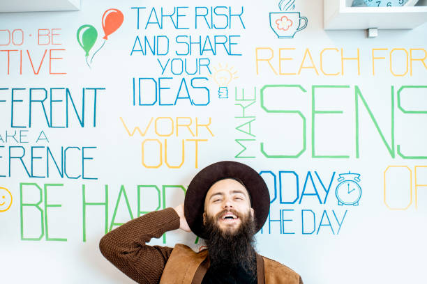 istock Man on the wall background with various inscriptions 1147553934