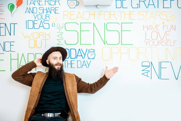 istock Man on the wall background with various inscriptions 1147553948