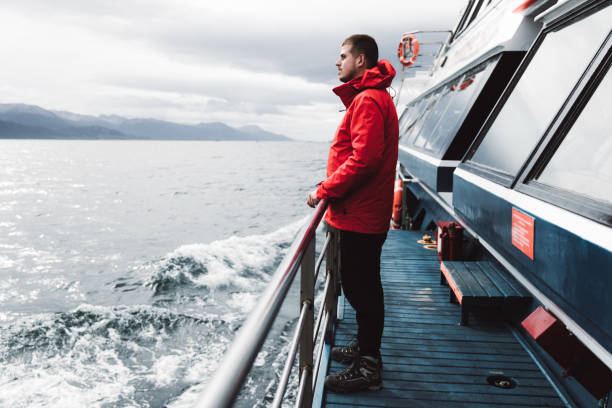 istock Man exploring the Beagle Channel in Ushuaia by cruise ship 1147554058