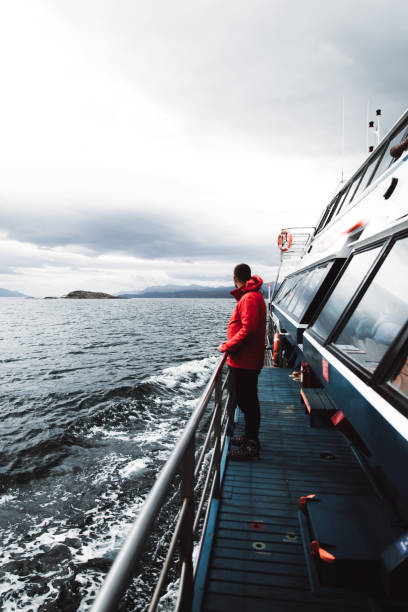 istock Man exploring the Beagle Channel in Ushuaia by cruise ship 1147554592