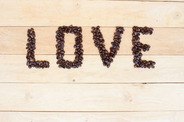 istock hot cappuccino with nice milk pattern and coffee bean LOVE text 1147555096
