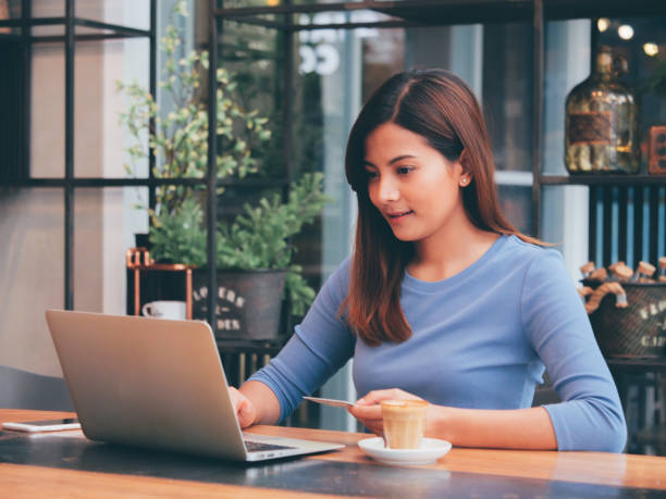 istock Asian woman in cafe 1147555816