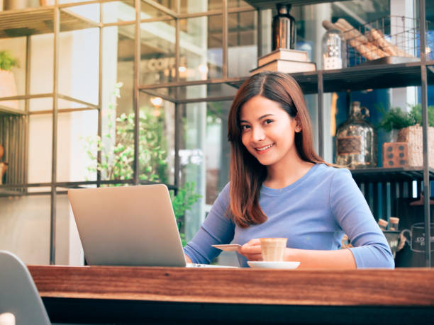 istock Asian woman in cafe 1147555838