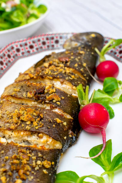 istock Roasted trout with vegetables walnuts and blue cheese 1147555865