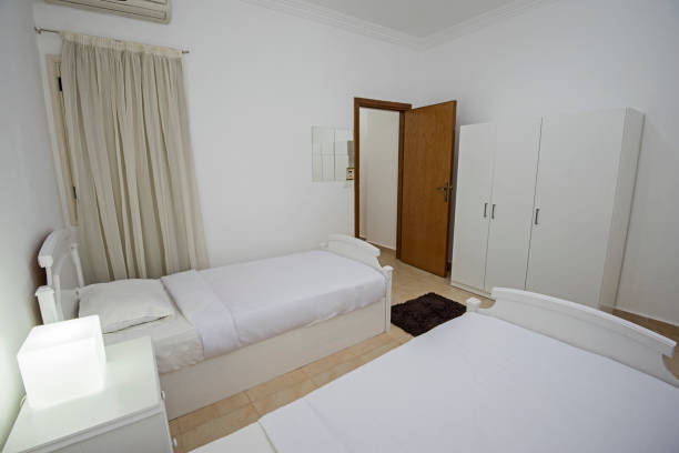 istock Twin beds in a luxury apartment 1147558112