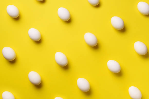 istock Food concept with white chicken eggs on violet background. Top view. Creative pattern in minimal style. Flat lay. 1147558772