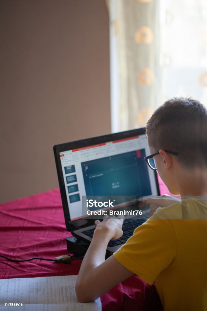 Doing Homework Using Technology Teenage Boy Doing Homework Using Computer Stock Photo - Download Image ...
