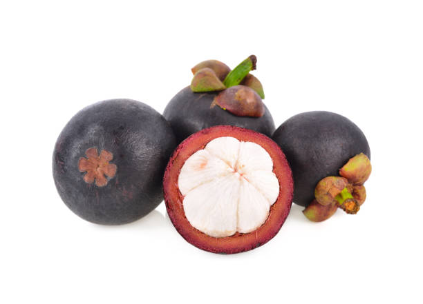 istock whole and half cut fresh Mangosteen on white background 1147566543