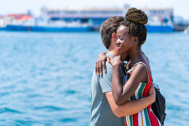 istock Man welcomes his girlfriend on pier 1147568656