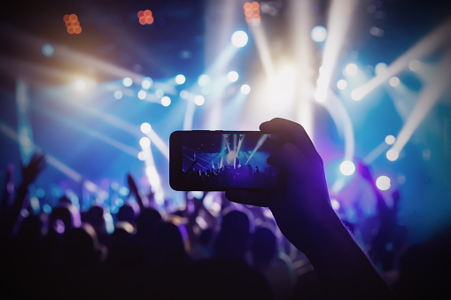 Photo for social networks at the concert, Mobile phone on music show