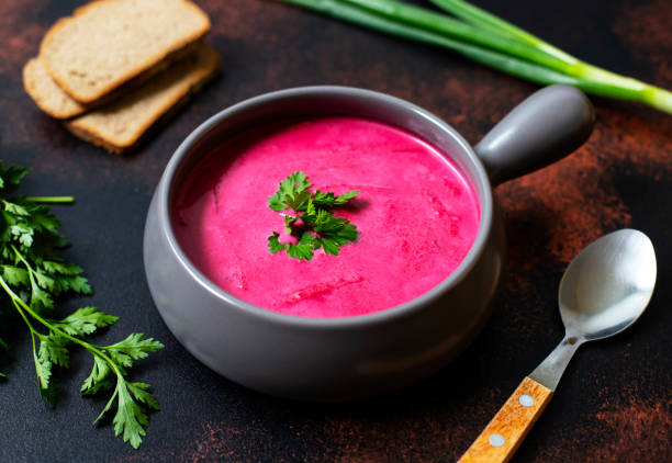 istock Cold Creamy Beetroot Soup, Beetroot Gazpacho Served in a Rustic Clay Bowl with Bread and Fresh Herbs. Rustic Background. Vegetarian, Clean Eating Food Concept. Copy Space. Close up 1147569671