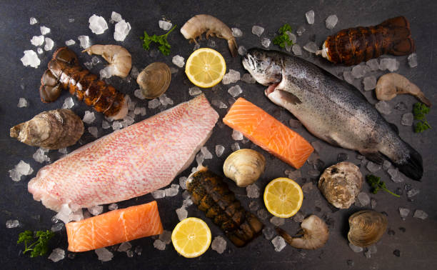 a collage of various seafood items from a fishmonger or fish market - alaskan salmon imagens e fotografias de stock
