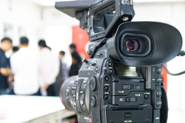 istock Video camera that is recording a group of people 1147572432