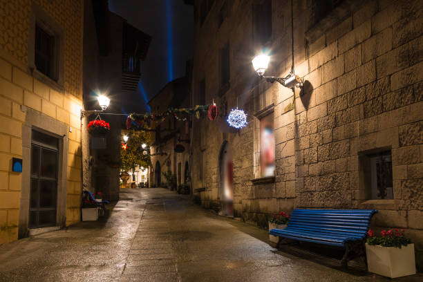 Barcelona, Catalonia, Spain - November 17, 2018: Beautiful night view of an illuminated street and buildings in the open-air Poble Espanyol architectural museum