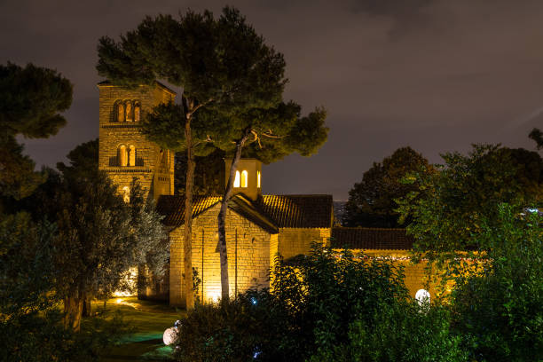 Barcelona, Catalonia, Spain - November 17, 2018: Beautiful night view of the illuminated Romanesque Chapel in the open-air Poble Espanyol architectural museum