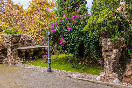 Terrace with flowers and bench on Montjuic Cemetery, Barcelona, Spain