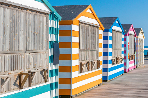 Beach cabanas in bright, bold colors taken in Hastings, UK