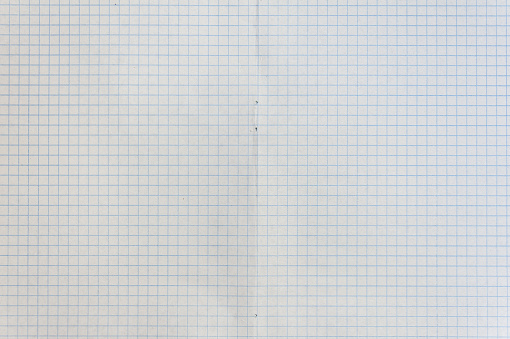 Sheet of engineering graph grid paper. Simple background texture for template, design or art. Close up.