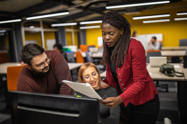istock Multi-ethnic group of people working together 1147579004
