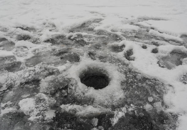istock Fishing hole on the lake. 1147579225
