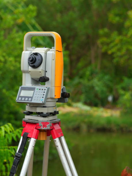istock Surveyor equipment at construction site 1147581104