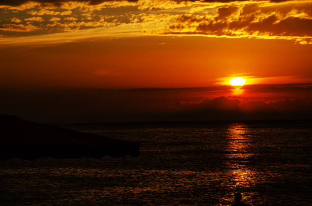 istock bright orange sunset at sea 1147581884