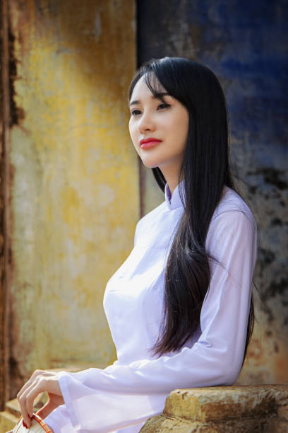 Beautiful girl with Vietnam culture traditional dress, Beautiful woman with  Ao dai vintage style. Beautiful girl with Vietnam culture traditional dress, Life of Vietnamese. Ao dai is a traditional costume famous Ho Chi Minh Vietnam.Hoi an Vietnam."n ao dai stock pictures, royalty-free photos & images