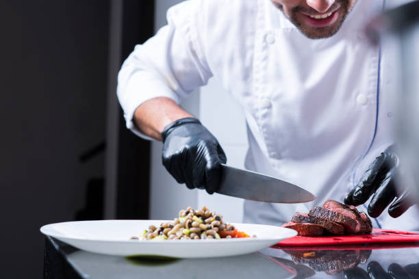 istock A professional chef prepares and decorates a dish with a delicious beef tenderloin 1147583522