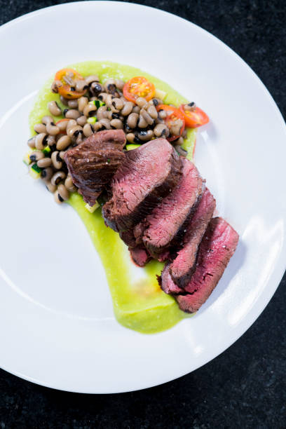 istock A professional chef prepares and decorates a dish with a delicious beef tenderloin 1147583603