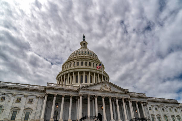 istock Washington DC capitol with waving flag 1147583624
