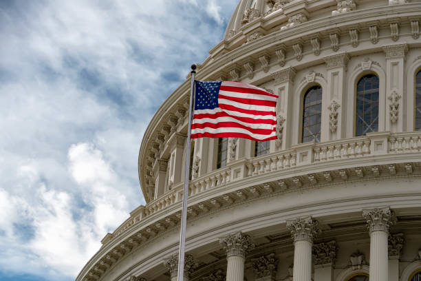 istock Washington DC capitol with waving flag 1147583649