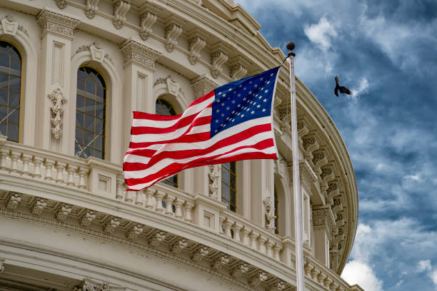 istock Washington DC capitol with waving flag 1147583661