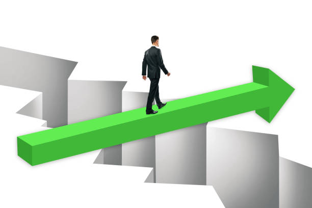 istock Businessman on green arrow over gap 1147583903