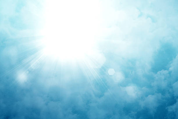 Sun on a blue sky with rays and flare, abstract fresh sunburst background.