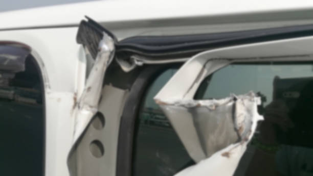 istock blur white door car with crash accident damage 1147584318